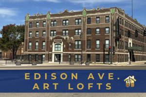 Exterior photo of 4 story historic brick building with words Edison Ave Art lofts