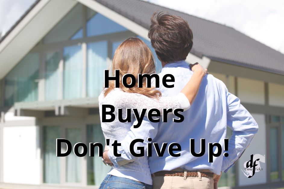 Words Home Buyers Don't Give Up!Man & woman with their arms around each other standing outside looking at a house.