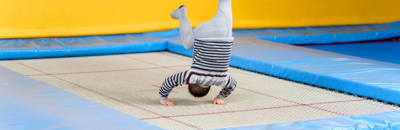 Child playing on an indoor trampoline