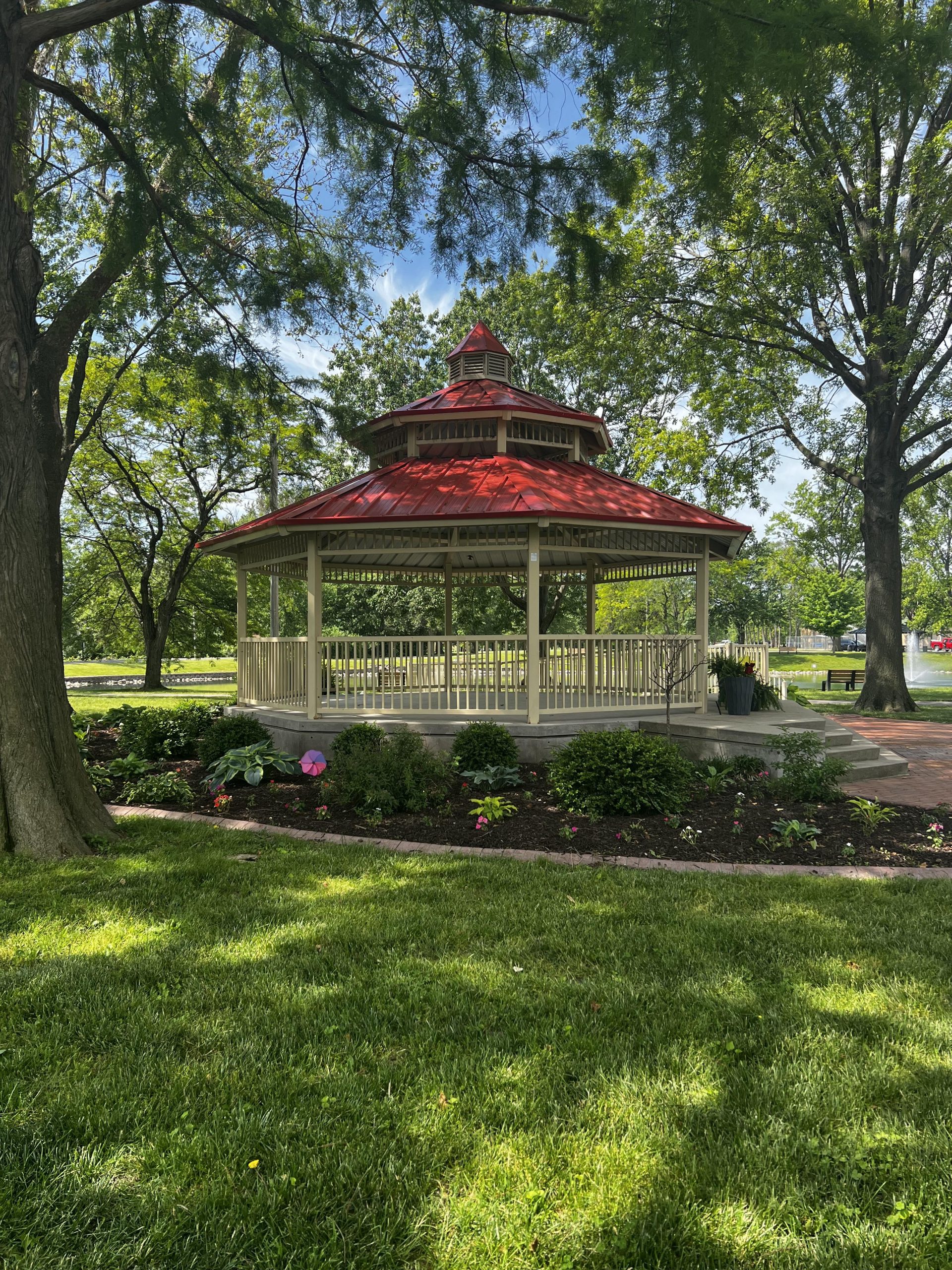 Gazebo with Red Roof and spring flowers