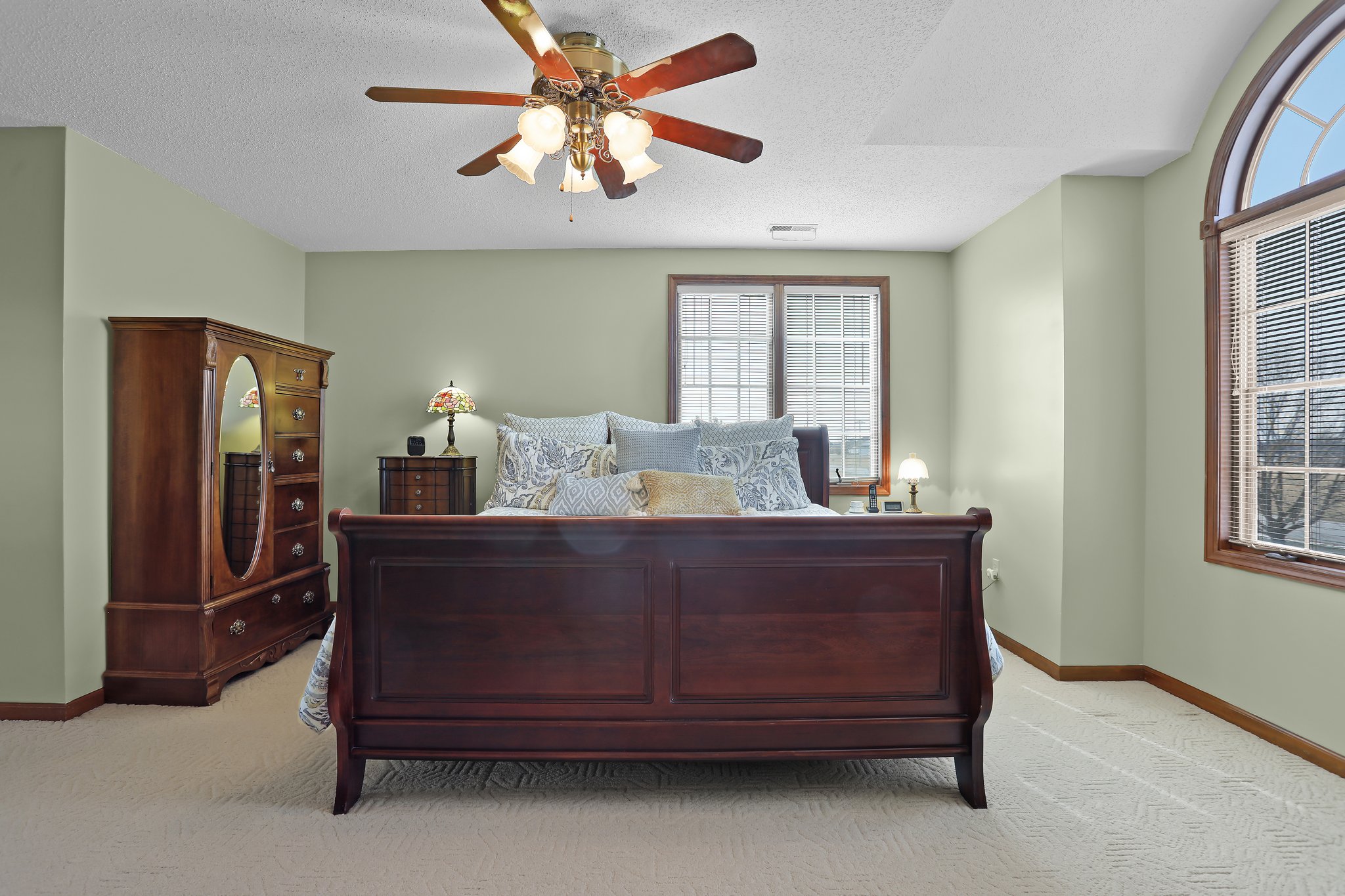 Home Features a Large Primary Suite, Ceiling Fan, and Berber Carpet