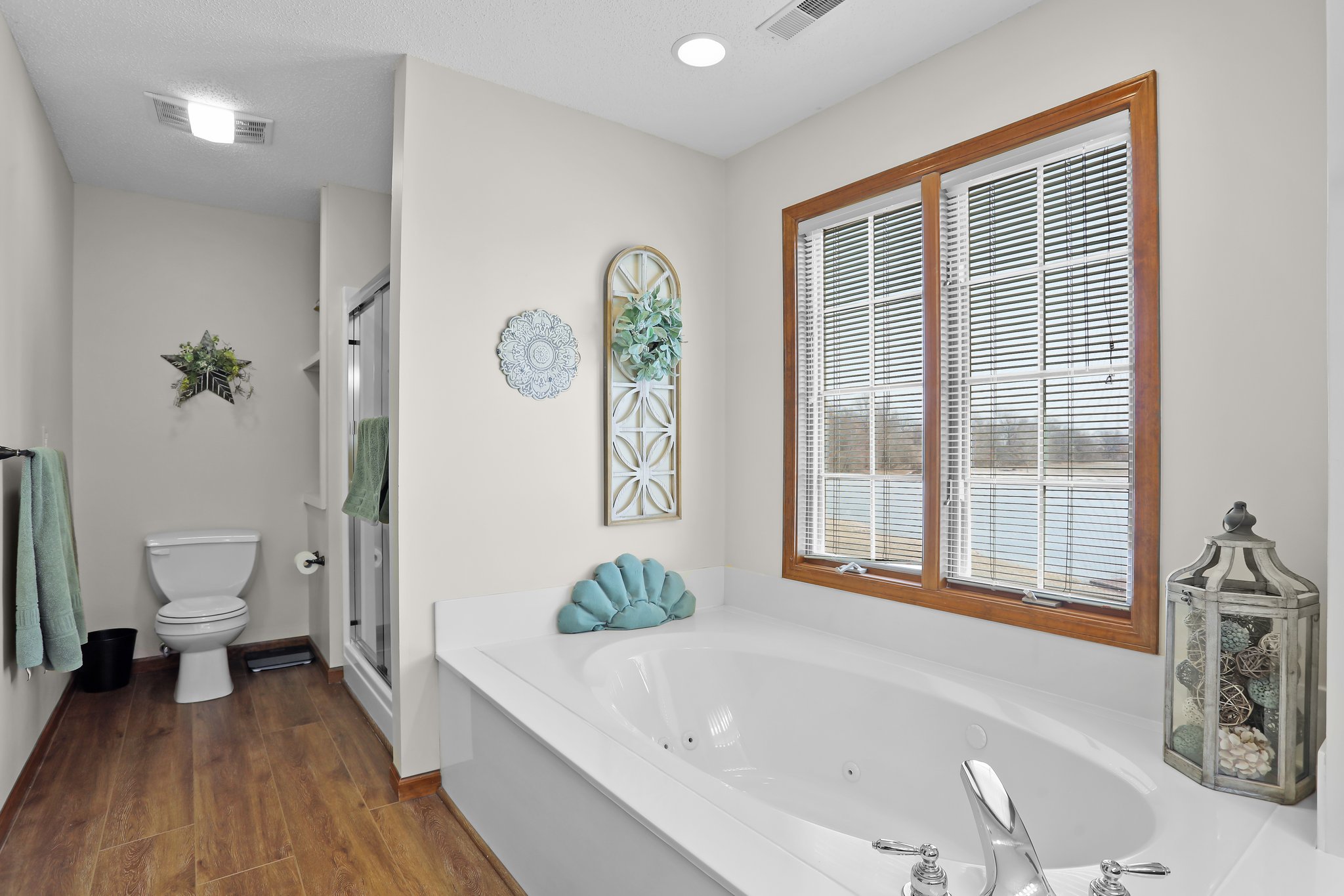 Home Features Primary Bathroom, Large Window, Plank Flooring, Separate Tub and Shower