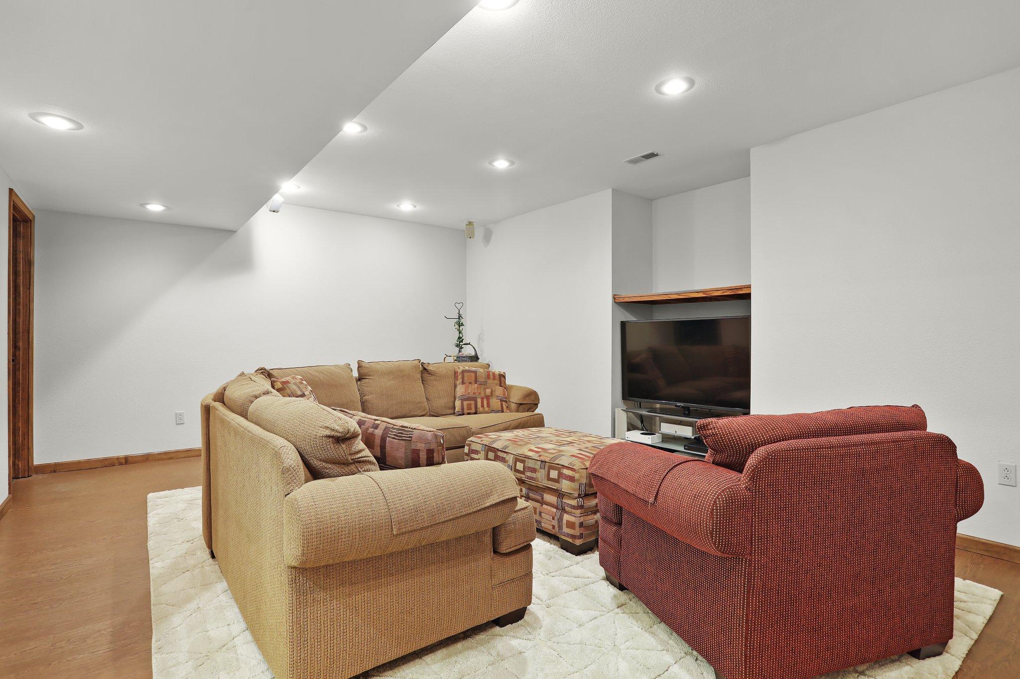 Home features family room, couches, and tv