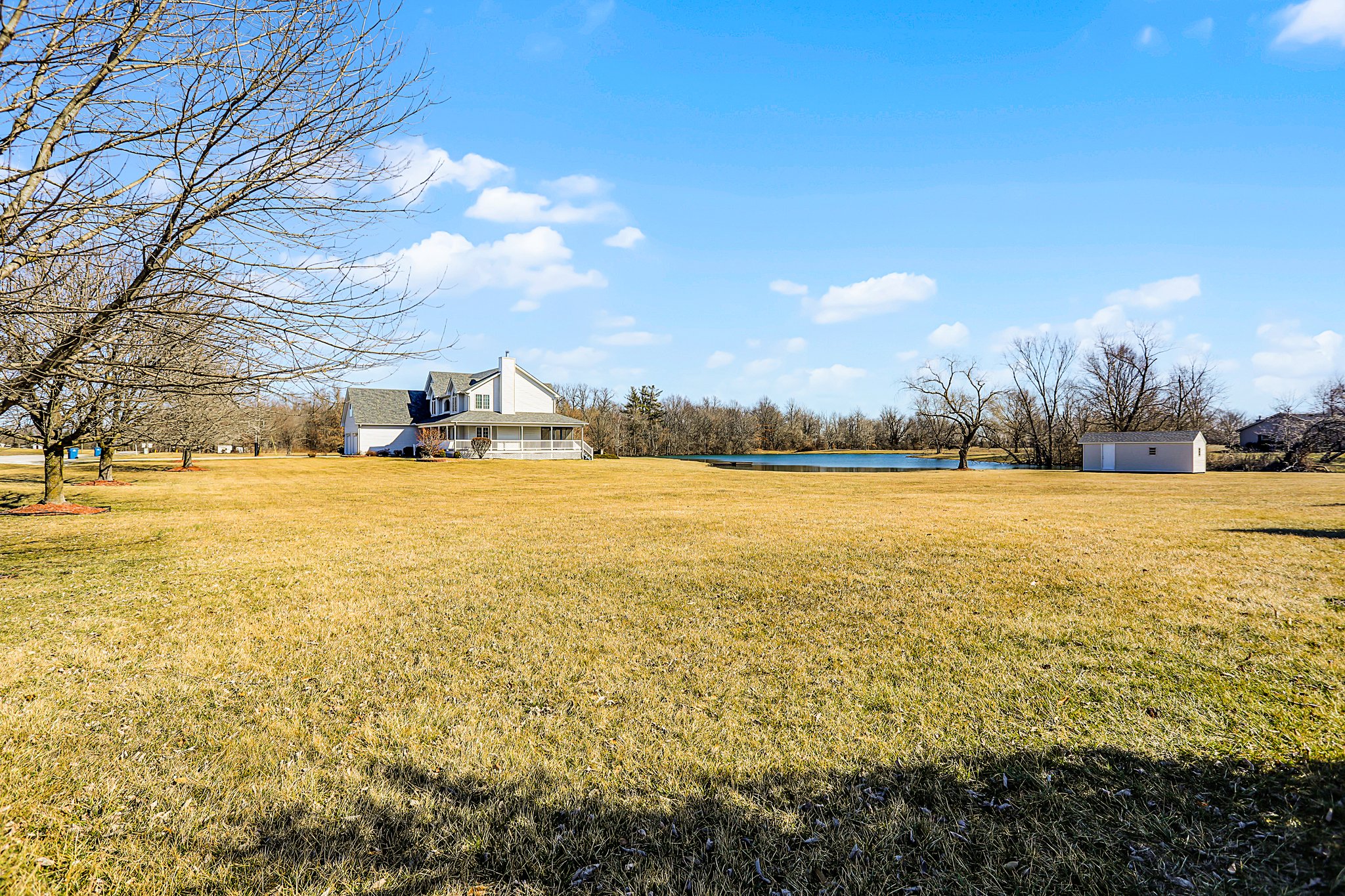 Property with home, large lot, and pond