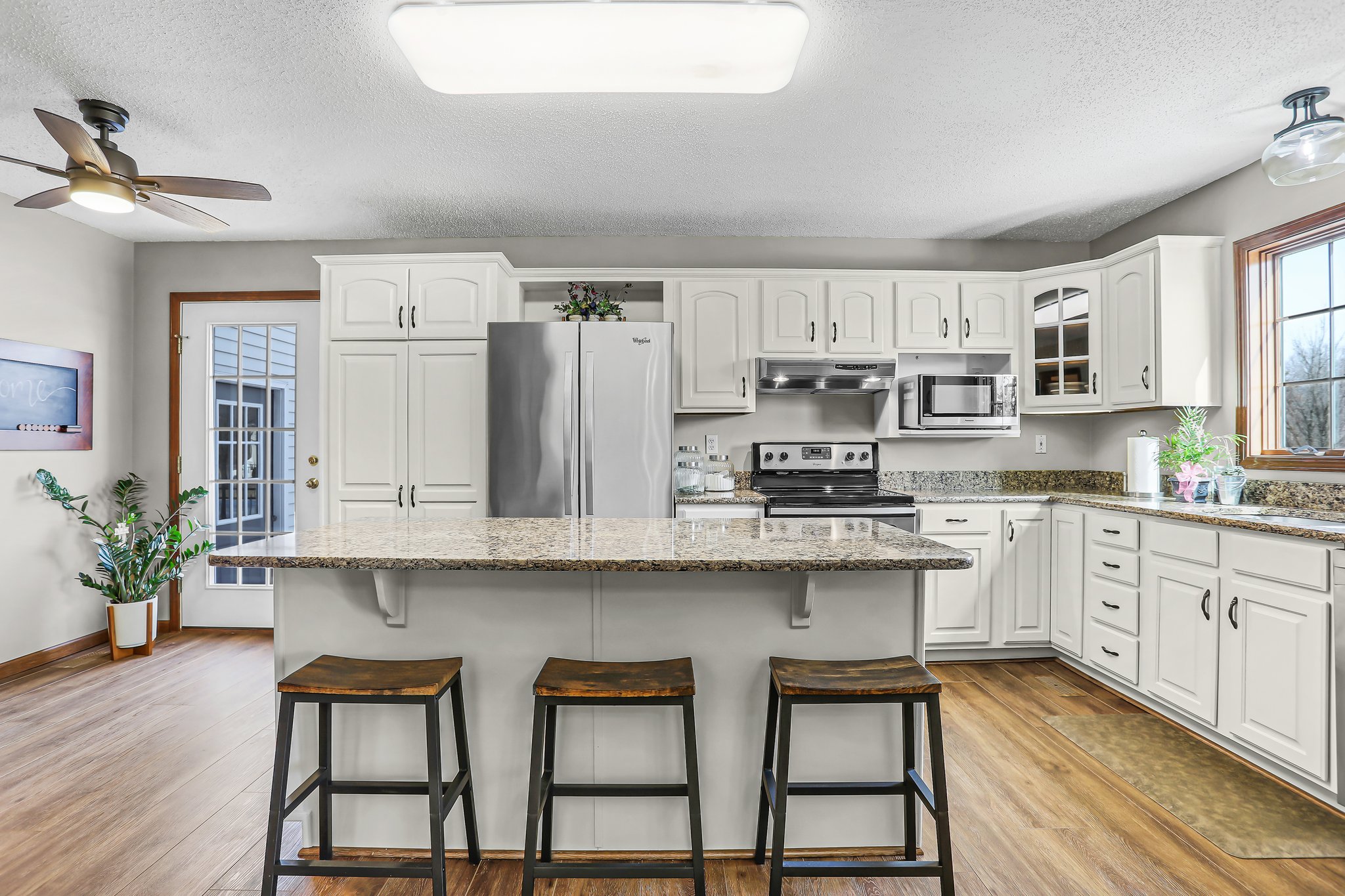 Kitchen Center Island, Cambria Quartz Countertops, Off-White Custom Cabinetry, Luxury Vinyl Plank/Wood Style Flooring and Stainless Steel Appliances