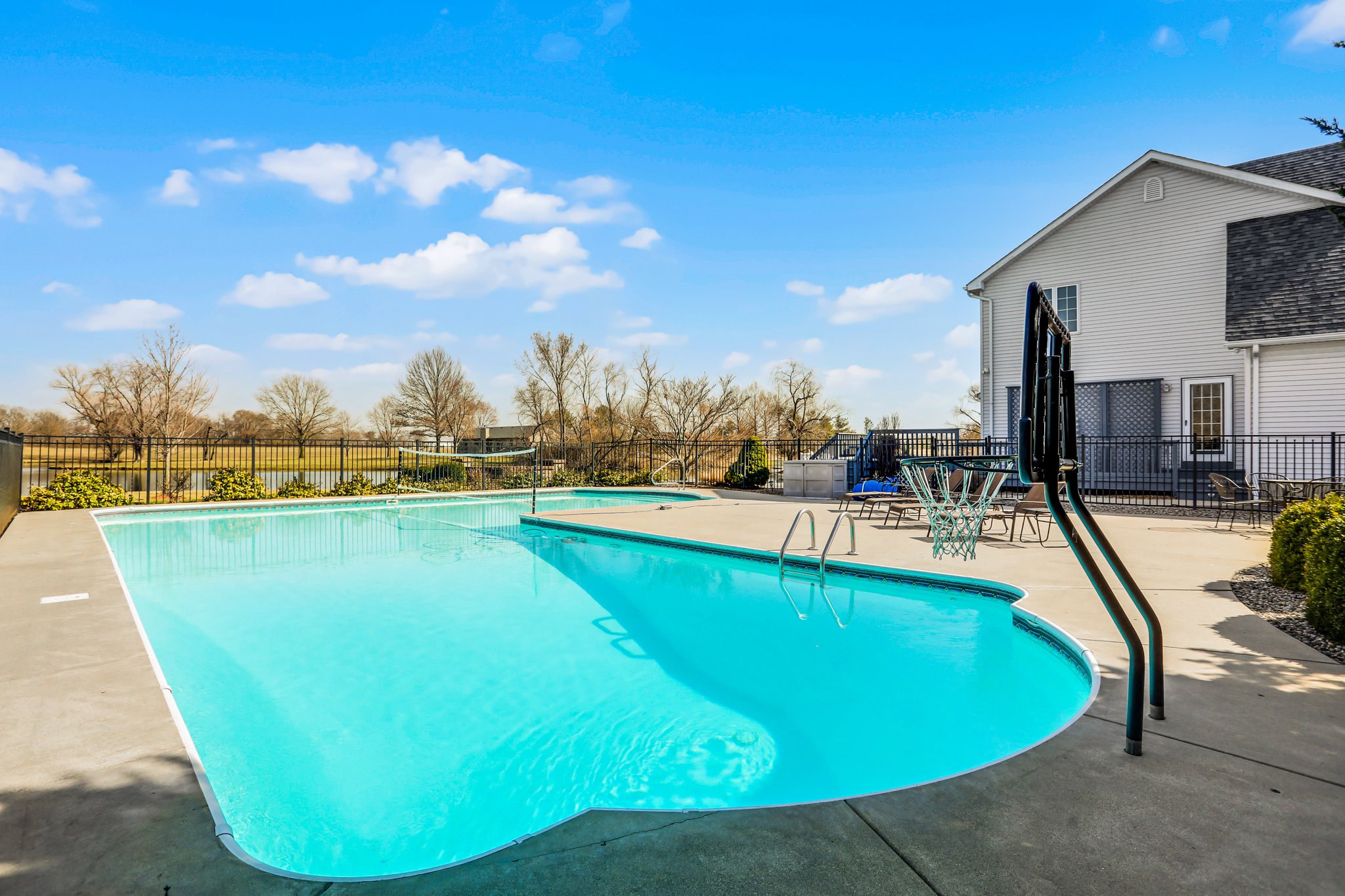 Inground pool, large patio, and water views