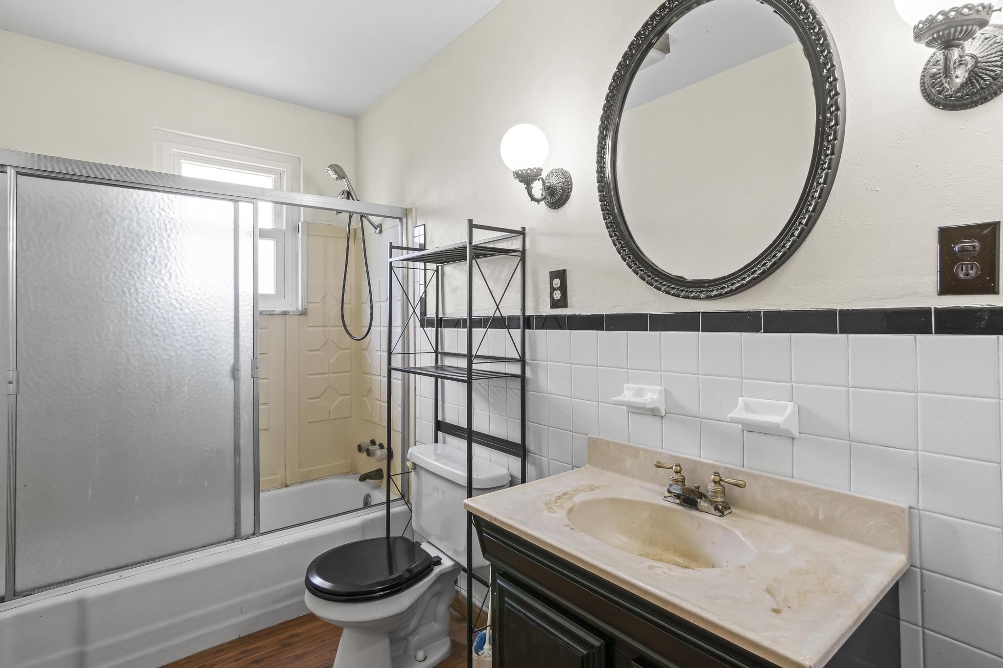 Bathroom tub/shower, laminate wood-style flooring