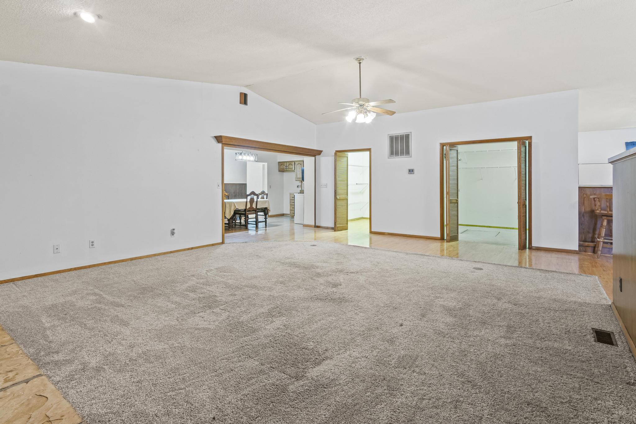 Great room, carpet, walk-in panty and walk-in storage closet