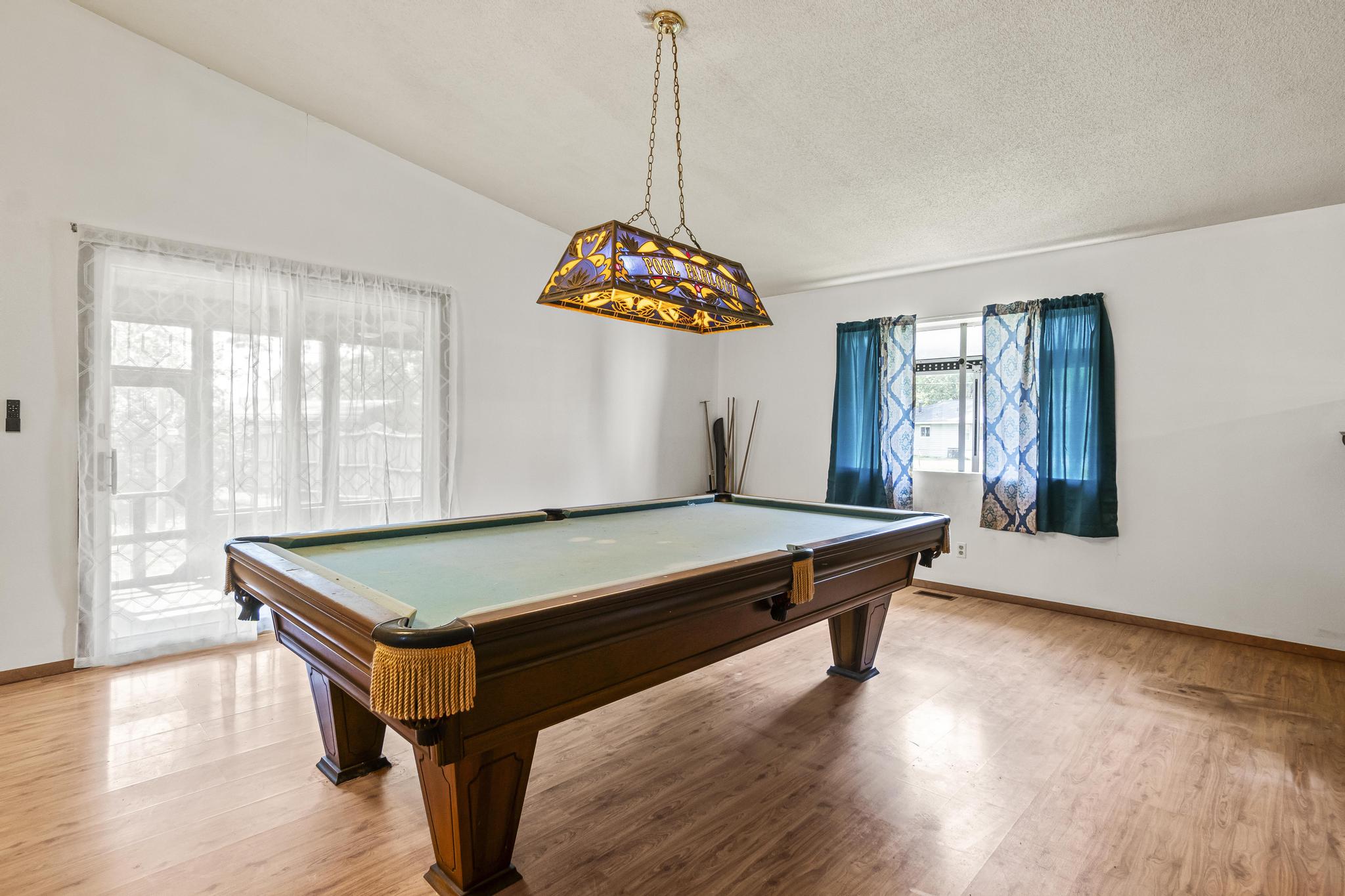 Great room/game area, Pool table, laminate wood-style floor