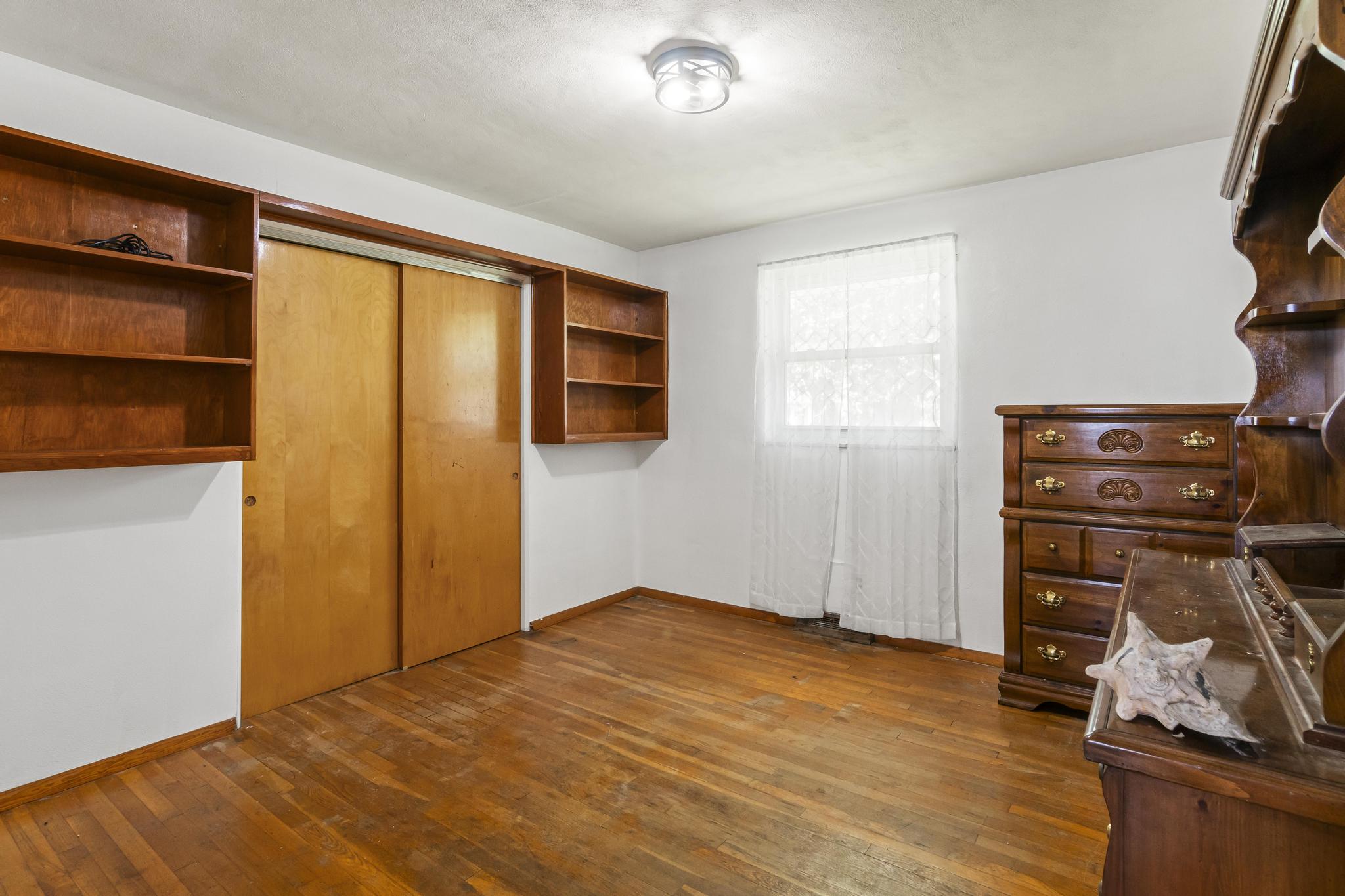 Bedroom 1, wood floors and double closet