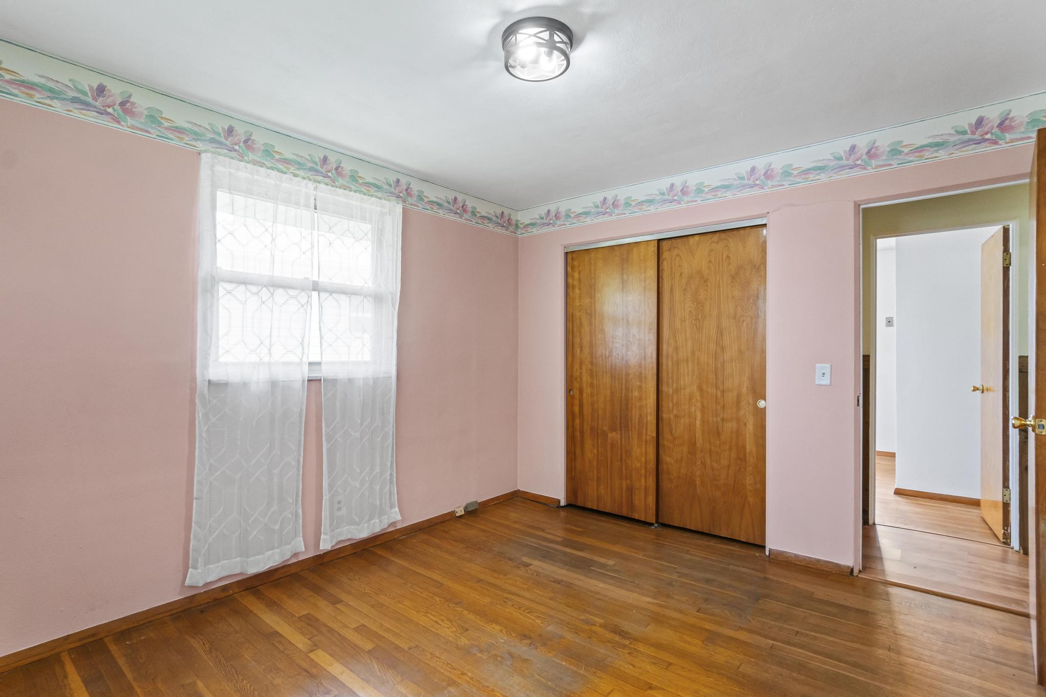 Bedroom 2, wood floors and double closet