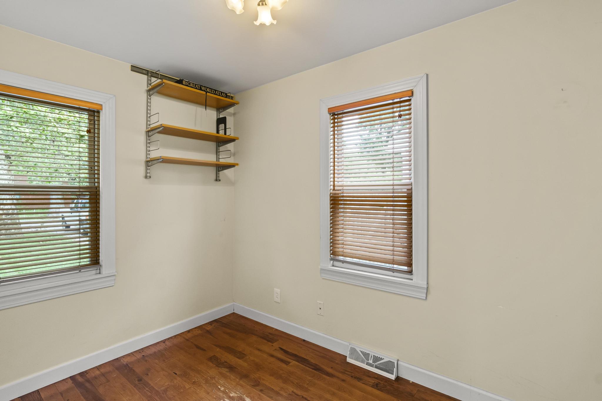 Spare room with wood flooring