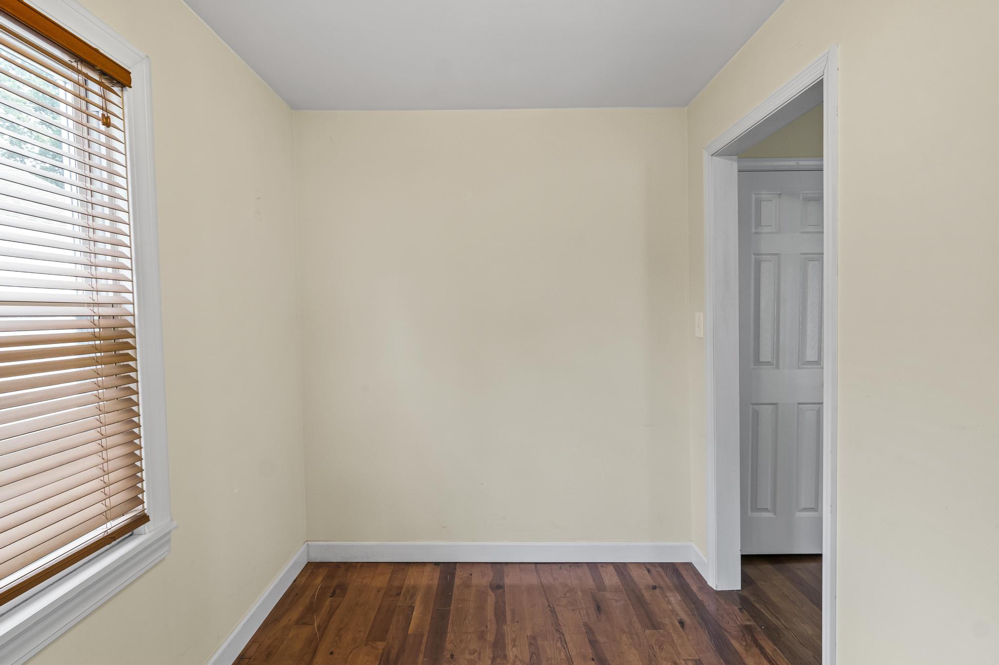 Spare room with wood flooring