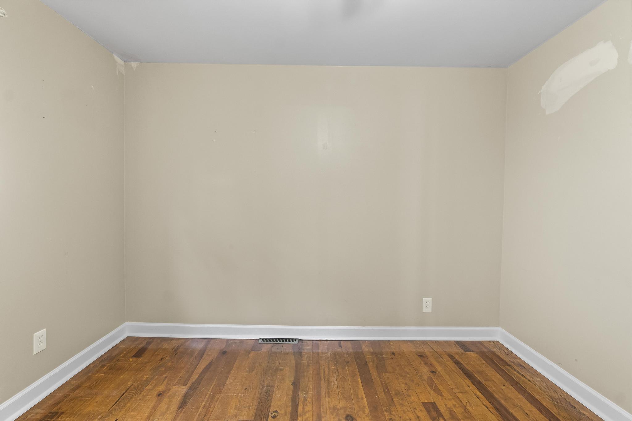 Bedroom featuring wood flooring
