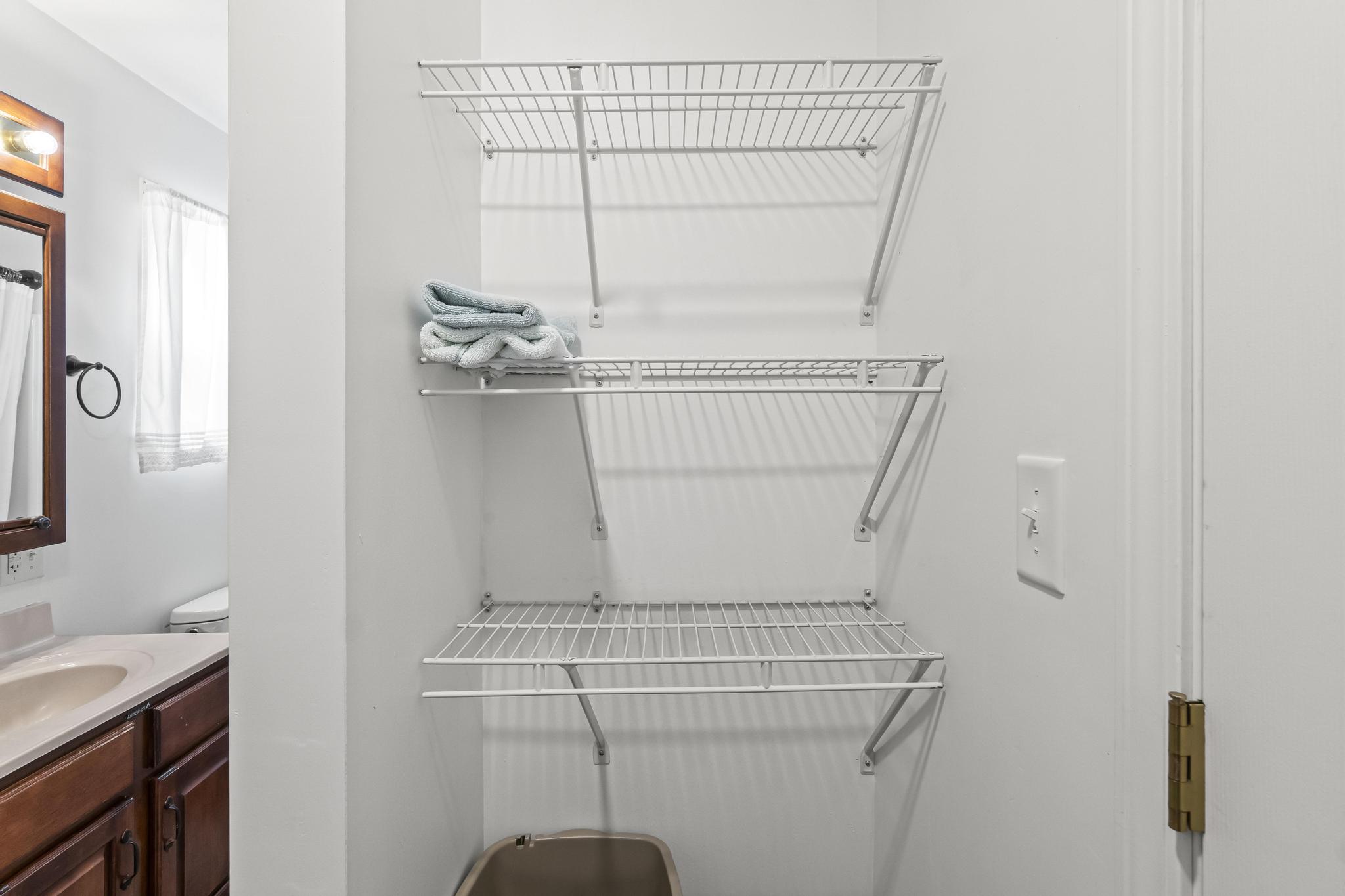 Master bathroom storage shelving