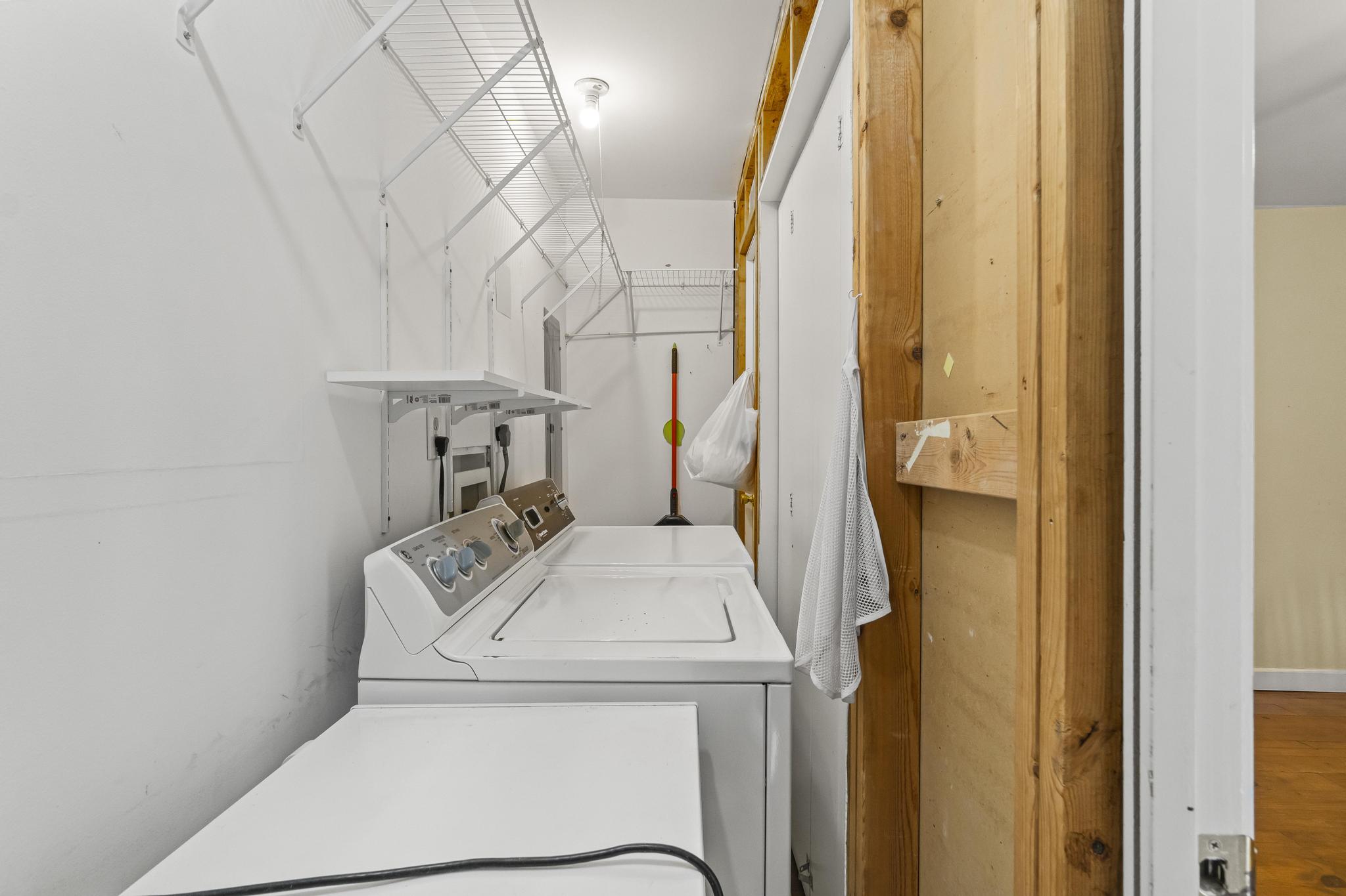 Laundry closet featuring additional storage