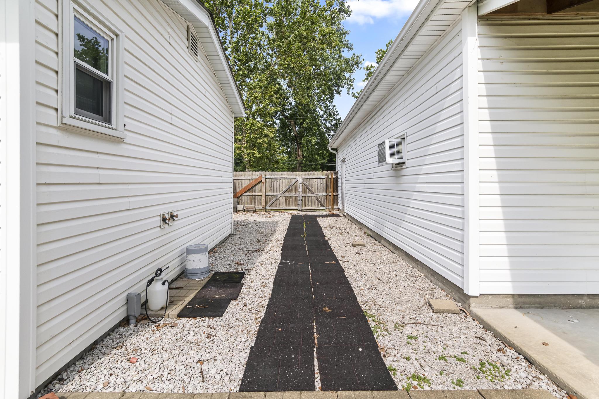 Exterior walk-way between the house and garage