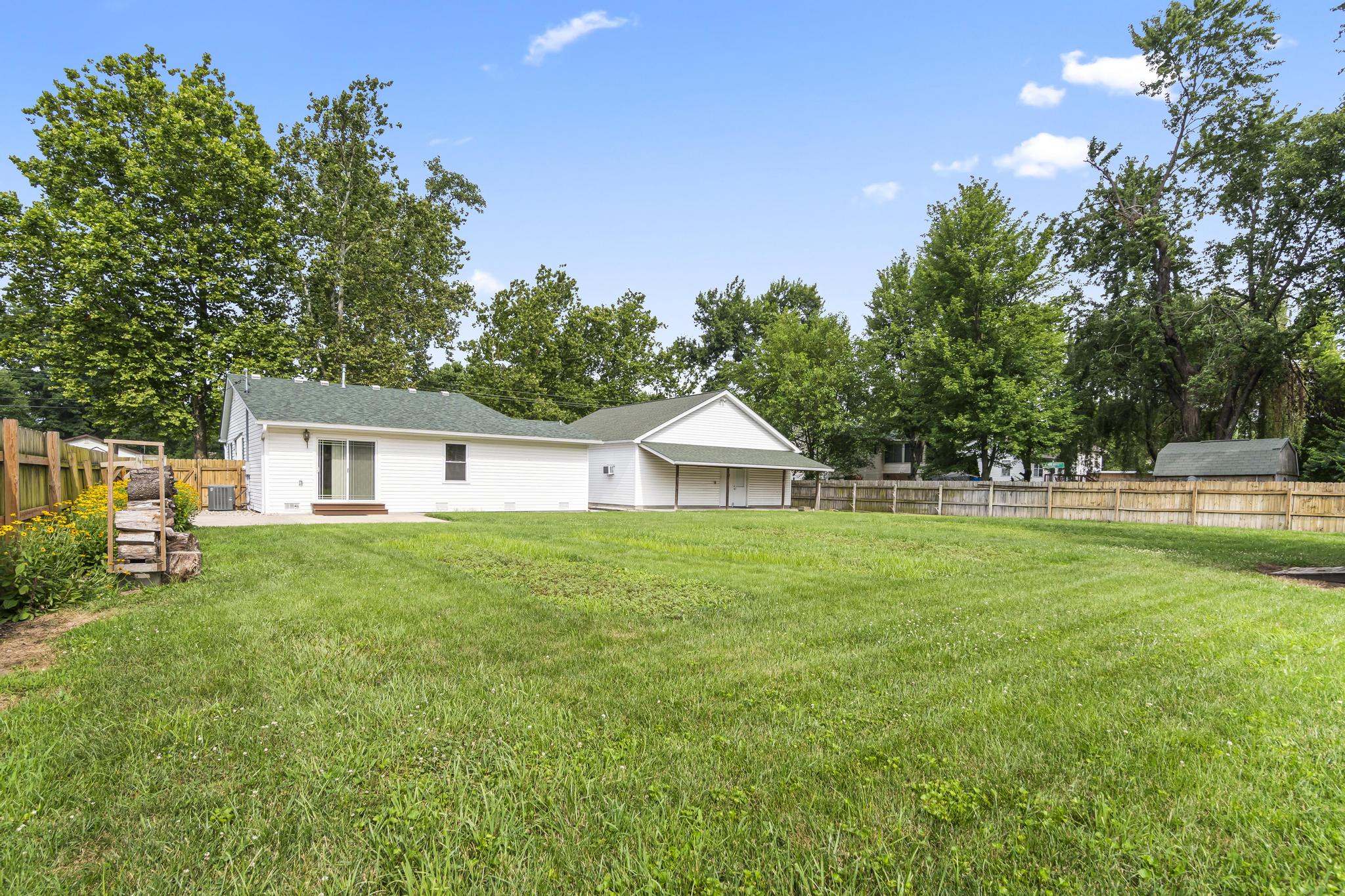 Exterior view of structures featuring wood privacy fencing