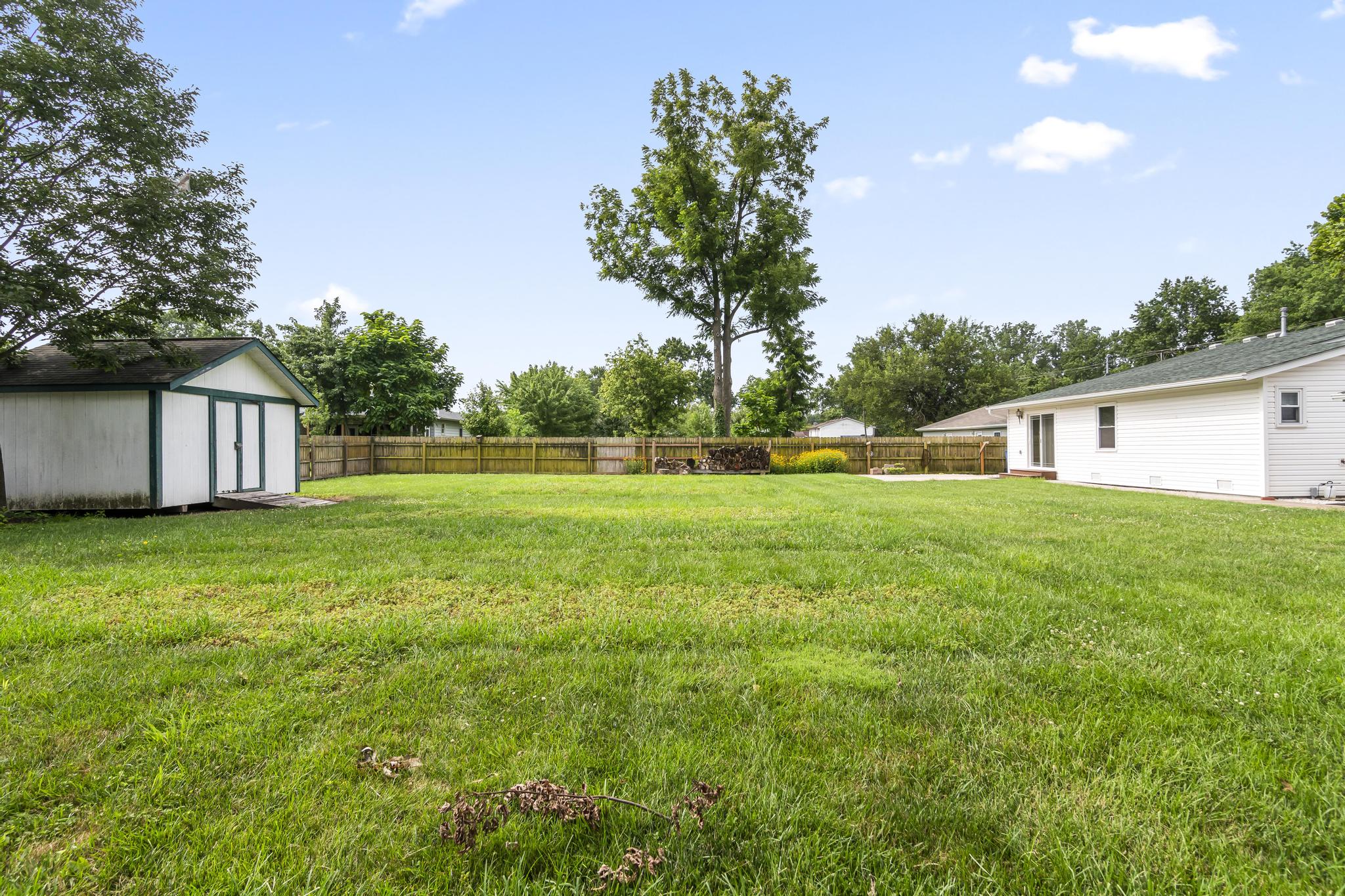 Exterior view of backyard featuring wood privacy fencing