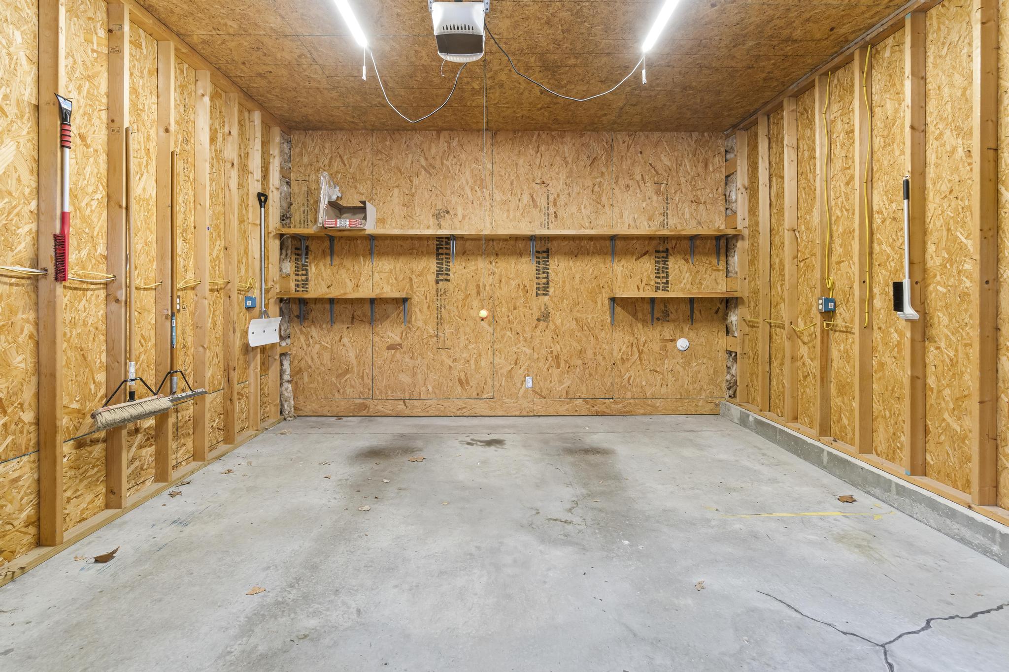 Garage interior view of right bay with shelving