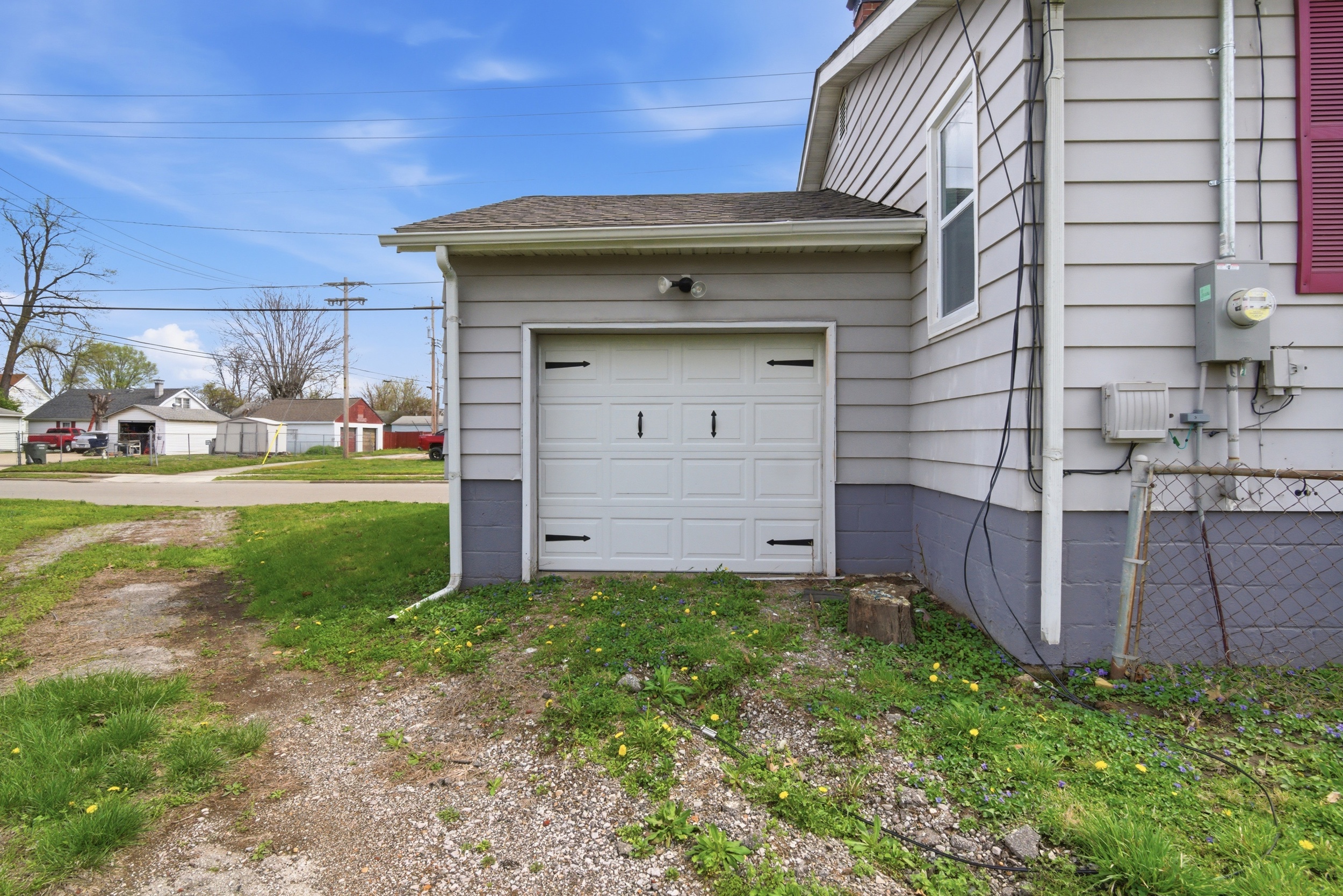 Close-up of attached single car garage with ally access at 1929 Beckwith St. Madison.